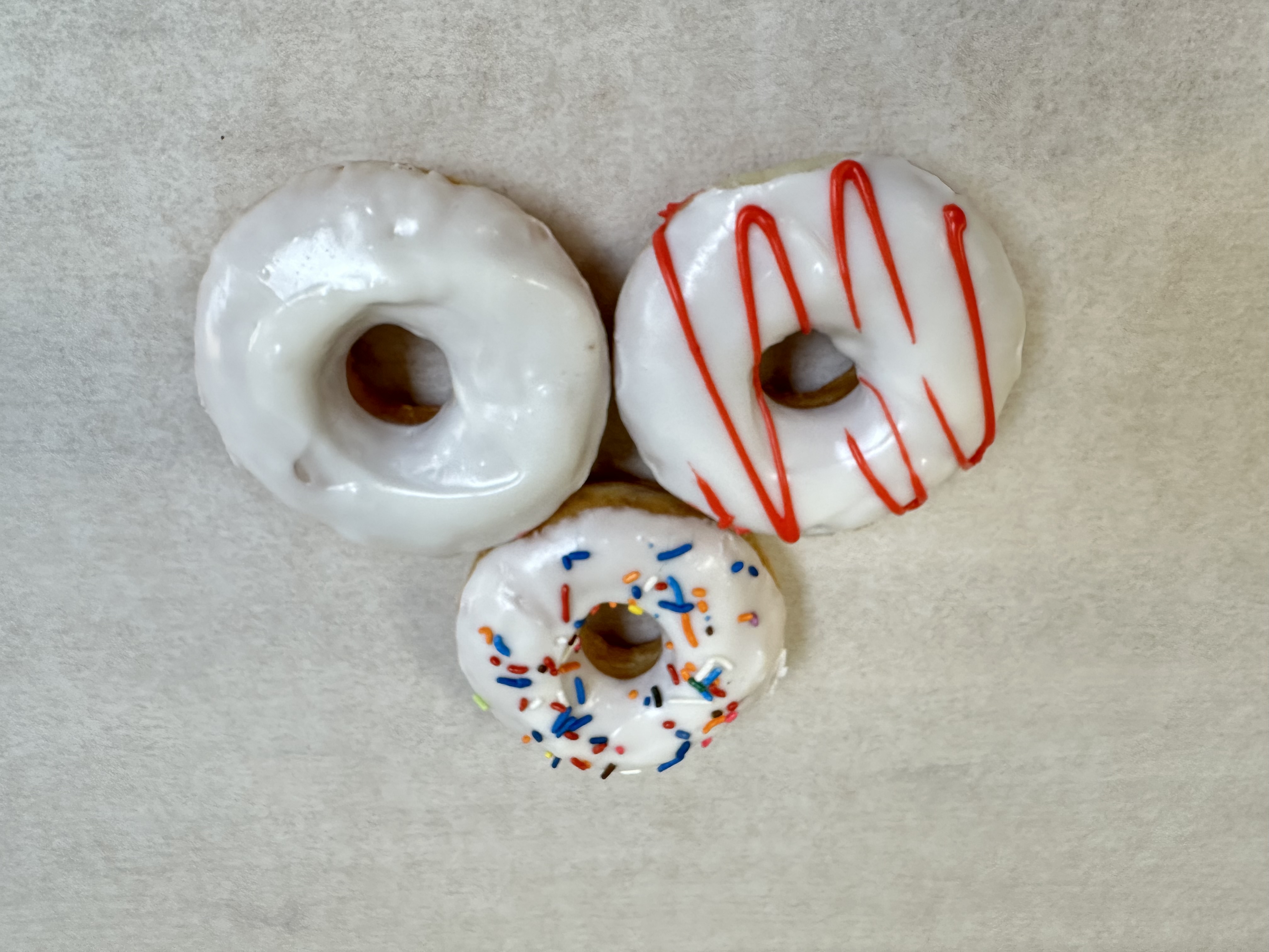 Smooth vanilla frosted donuts